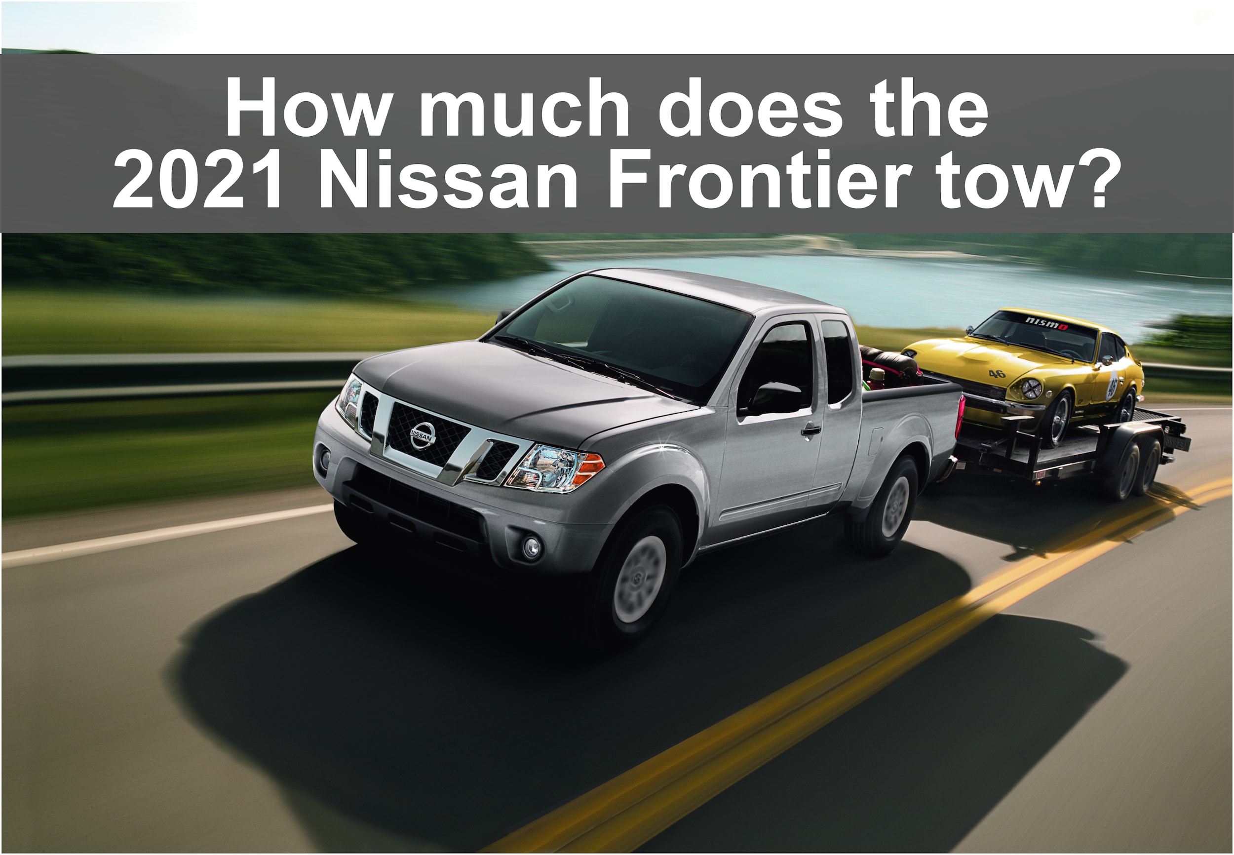 Driving View of Nissan Frontier towing vintage nissan