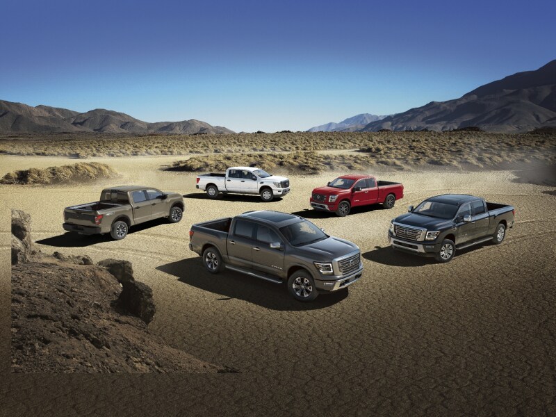 Nissan Titan trucks parked in the desert