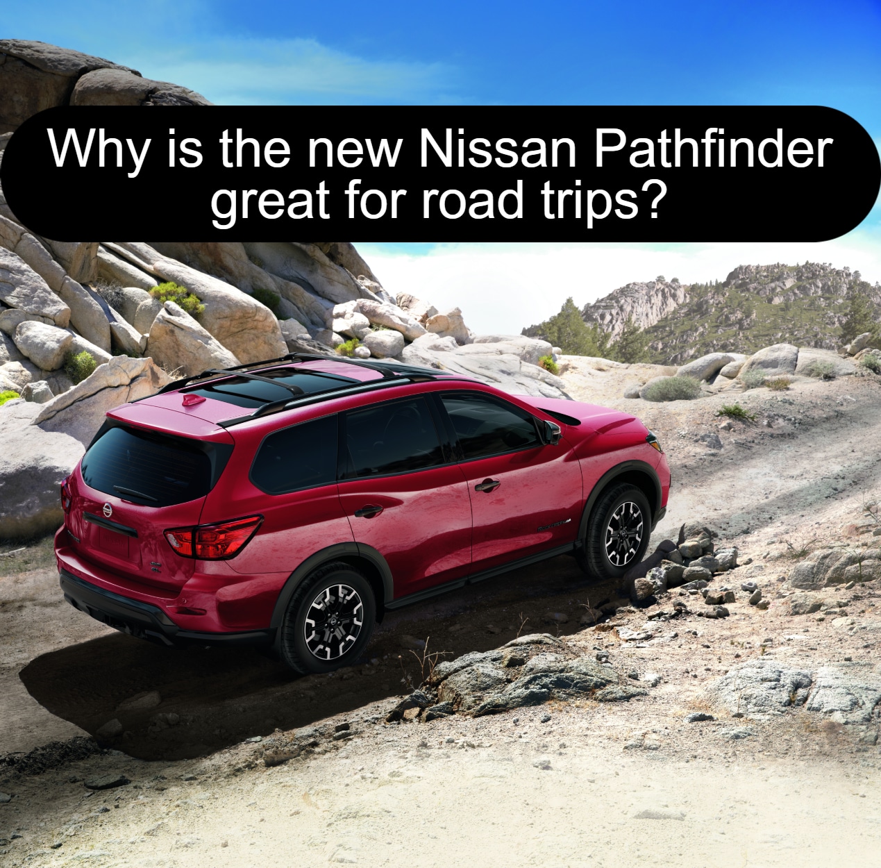 Red Nissan Pathfinder SUV going uphill off road