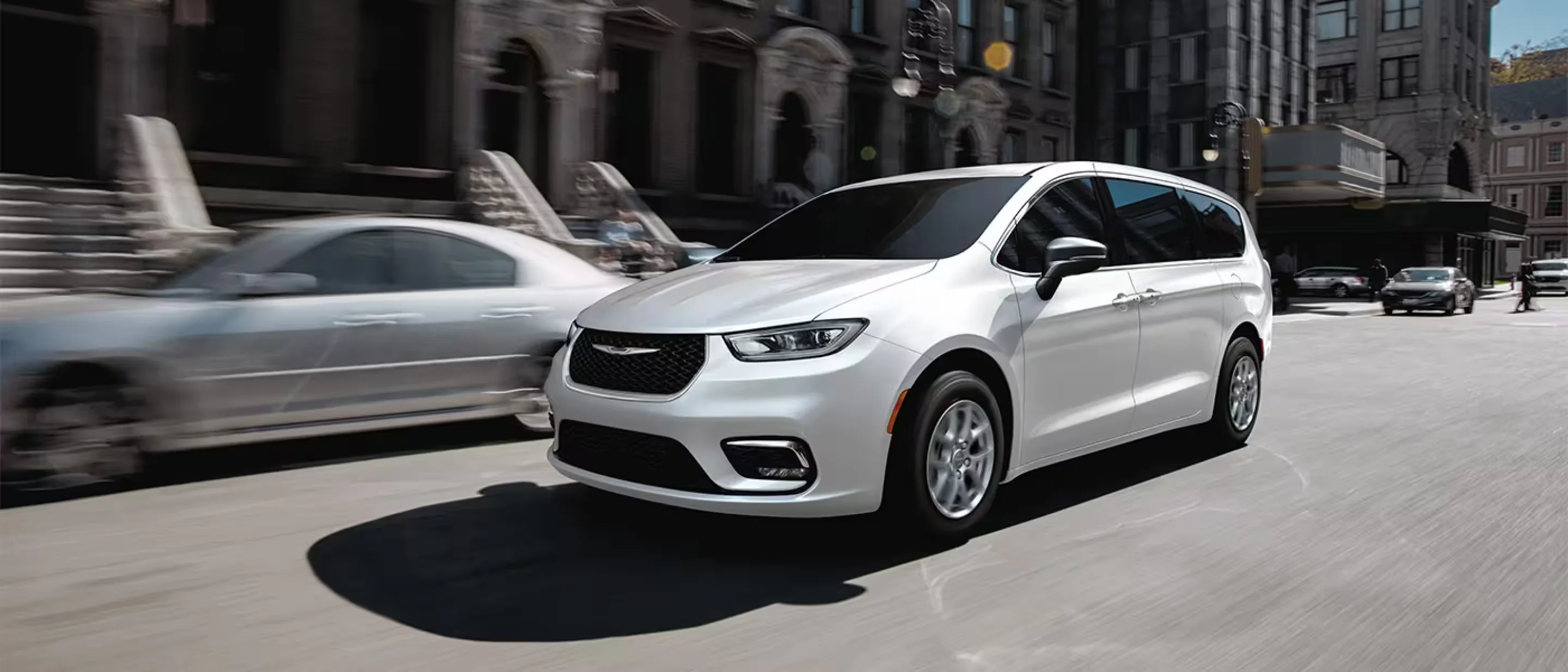 2026 Chrysler Pacifica Select in white on a boardwalk