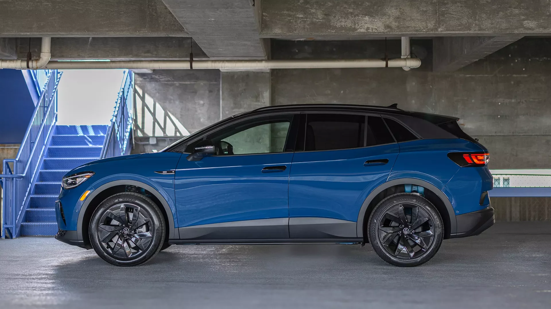2026 VW ID.4 side view in Mountain Lake Blue Metallic — 291-mile range covers Fort Liberty, the OBX, and beyond from Goldsboro, NC