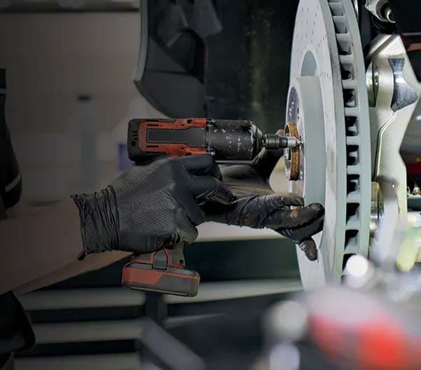 Mercedes-Benz service worker working on a Sprinter Van.