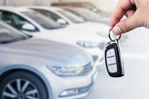 close up of a hand holding car keys