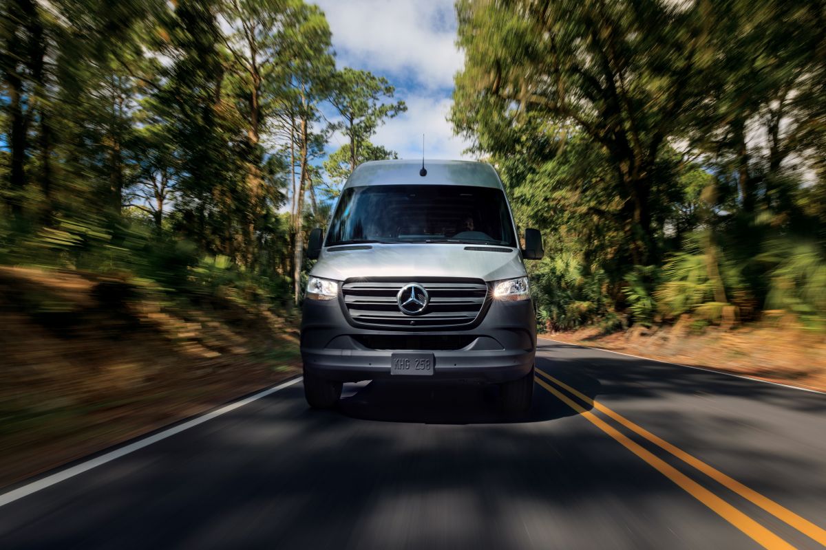 2025 Mercedes-Benz Sprinter Cargo HighRoof 144 Inch Wheelbase Driving Down Country Road