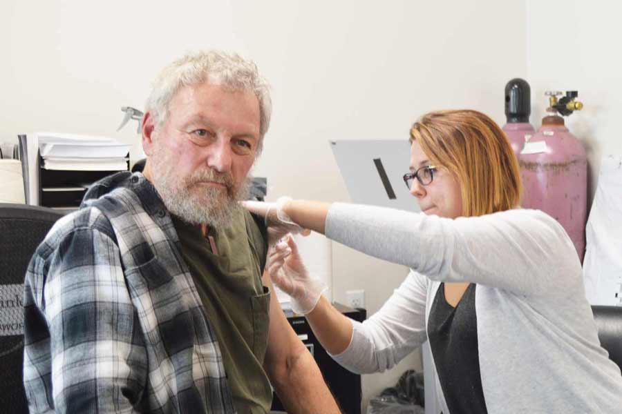 A guest gets his flu shot