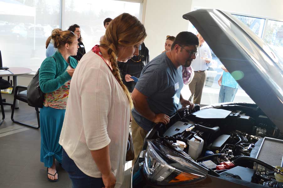 Guests check under the Ascent hood