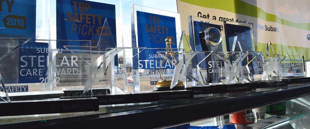 Awards shelf with five years of Stellar Care Awards
