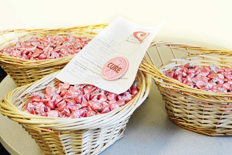 baskets full of pink-foil-wrapped chocolates