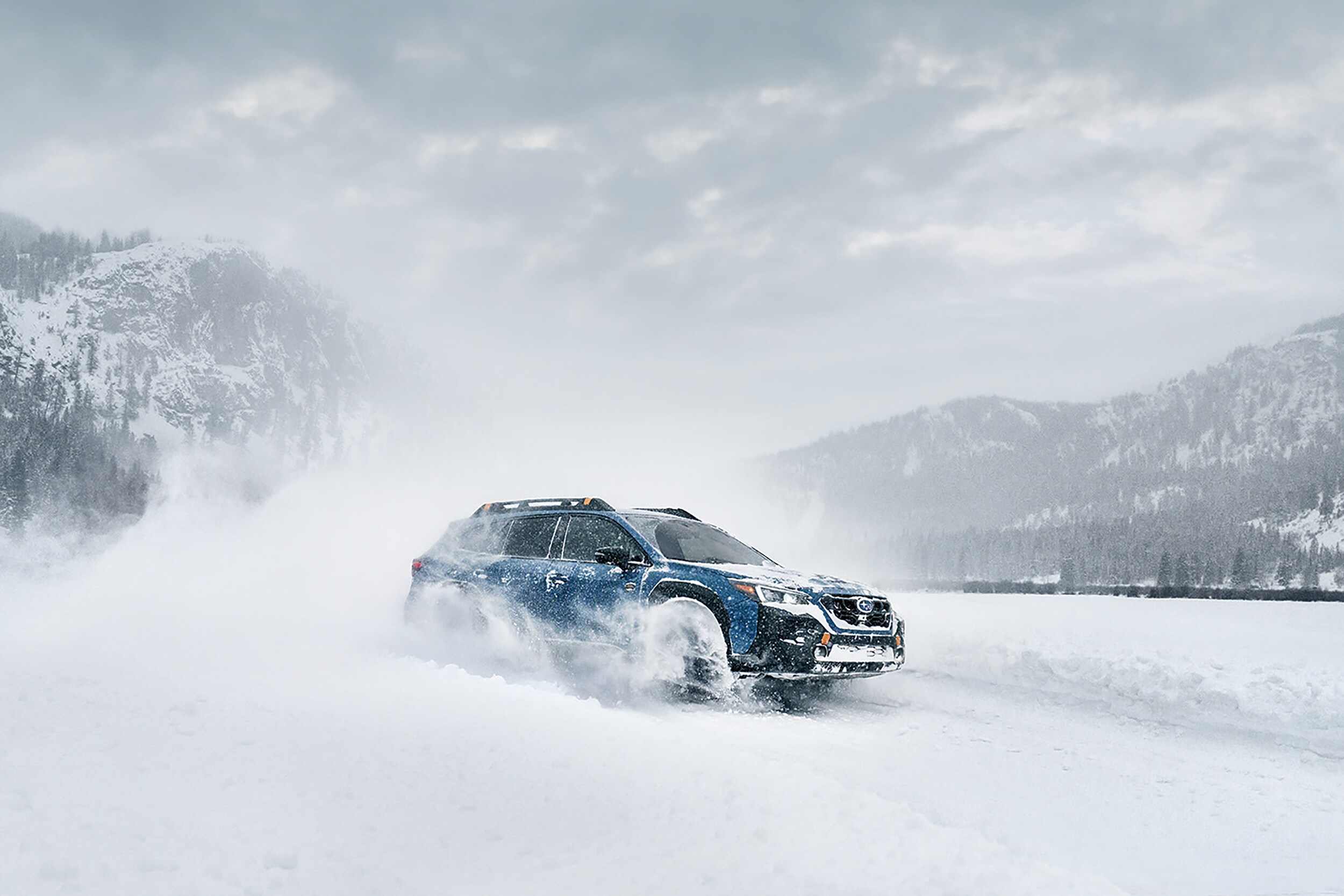Subaru Outback Wilderness driving through snow