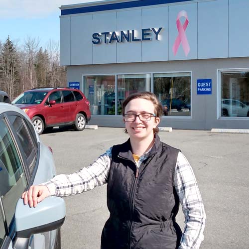Dalaney in front of Stanley Subaru