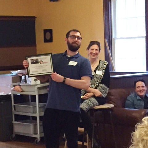 Spencer showing off his certificate