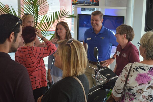 Mark talking to a crowd of guests
