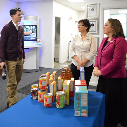 Reporter from WABI talks with advocates from MEA