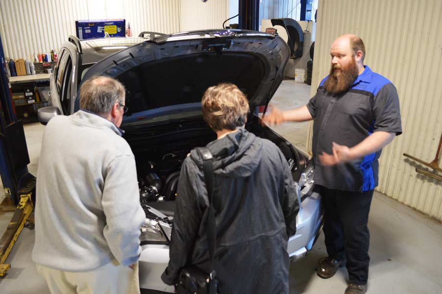 Nate explains some Subaru inner workings to guests