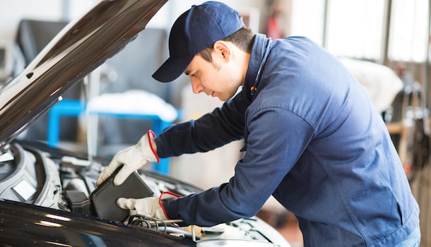 Tech working on car Tech working on car