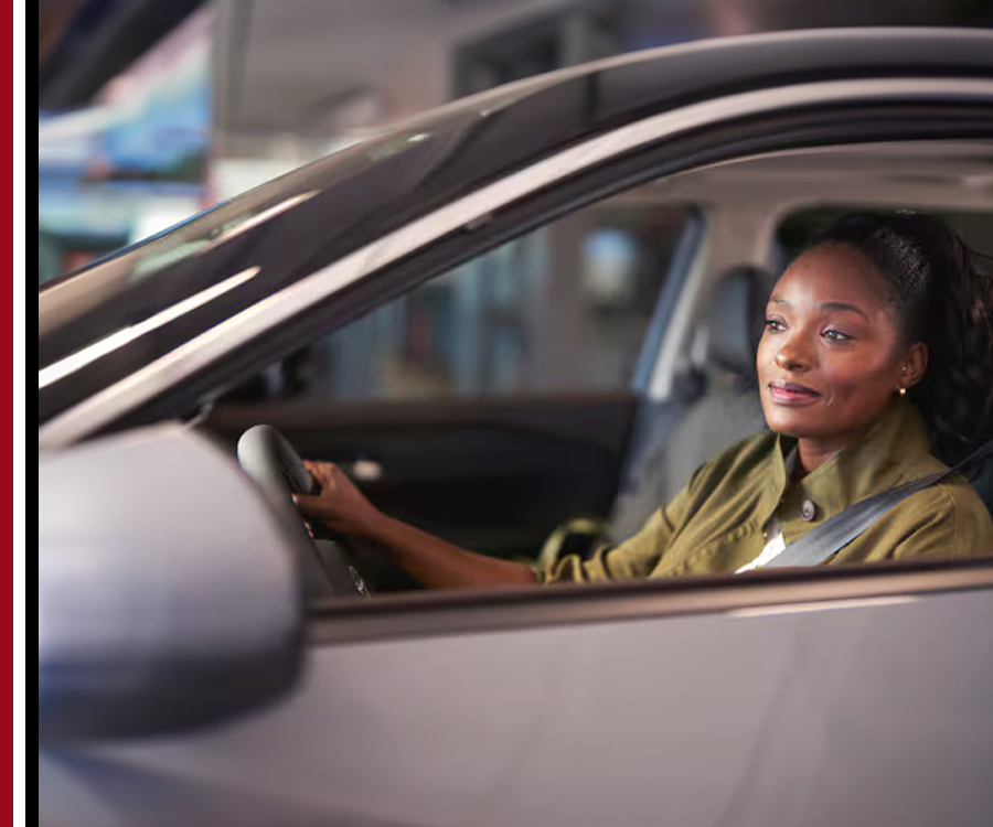 Woman in car looking out of driver's window