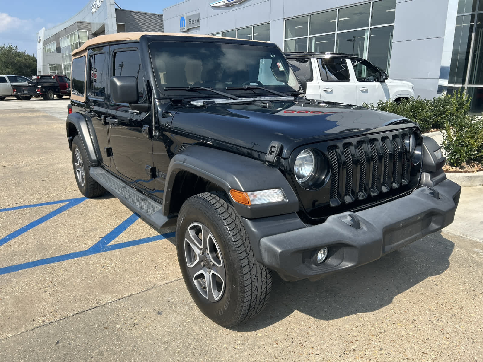 Used 2020 Jeep Wrangler Unlimited Black and Tan with VIN 1C4HJXDG6LW118717 for sale in Opelousas, LA