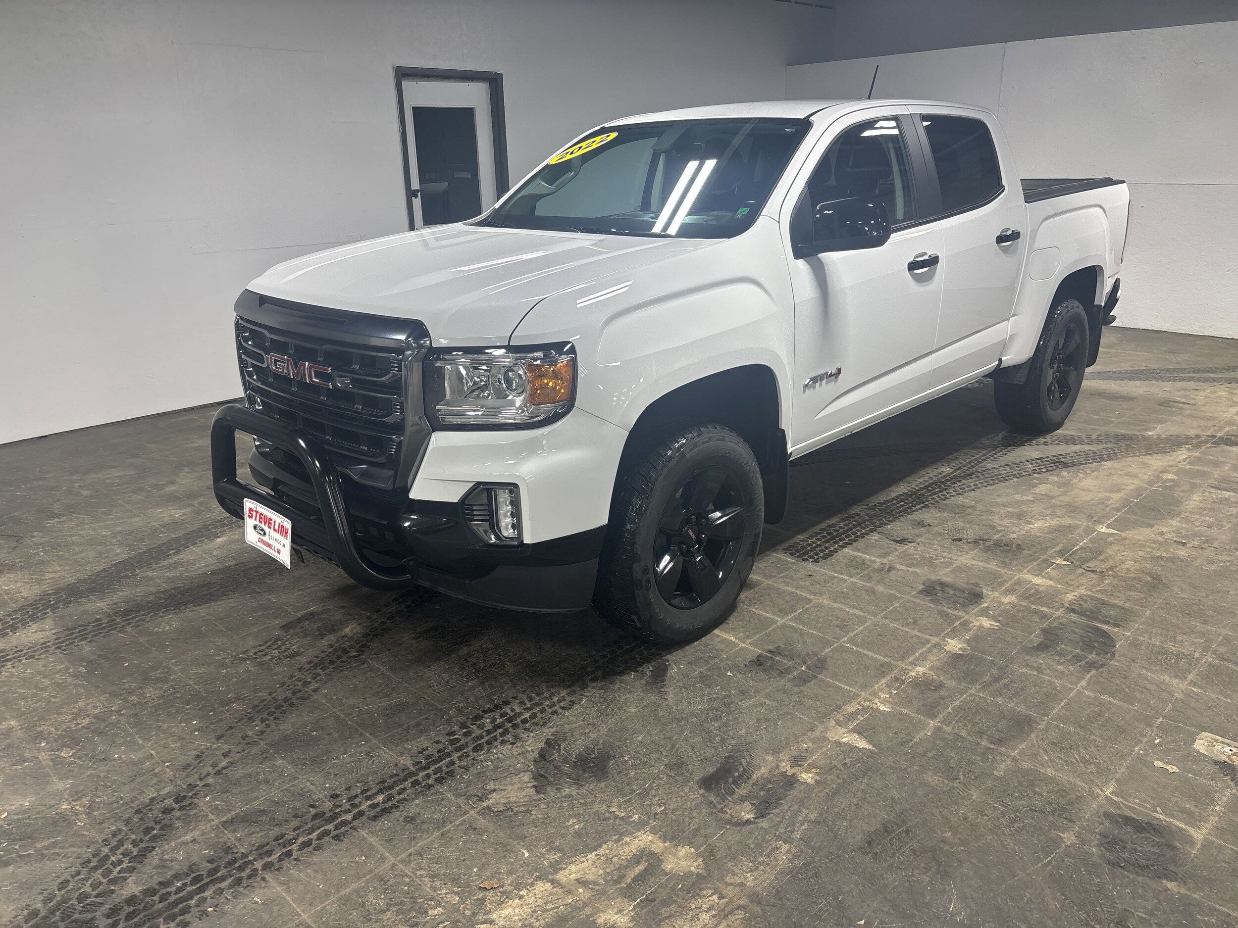 Used 2022 GMC Canyon AT4 with VIN 1GTG6FEN7N1330269 for sale in Grinnell, IA