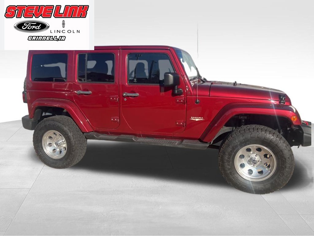 Used 2013 Jeep Wrangler Unlimited Sahara with VIN 1C4BJWEG9DL518062 for sale in Grinnell, IA