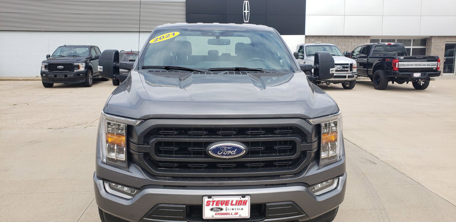 Used 2021 Ford F-150 XLT with VIN 1FTFW1E82MFA26731 for sale in Grinnell, IA