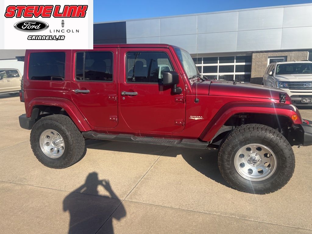 Used 2013 Jeep Wrangler Unlimited Sahara with VIN 1C4BJWEG9DL518062 for sale in Grinnell, IA