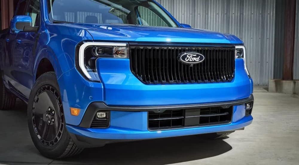 A blue 2025 Ford Maverick LOBO is shown parked near a Ford dealer near Huntingdon.