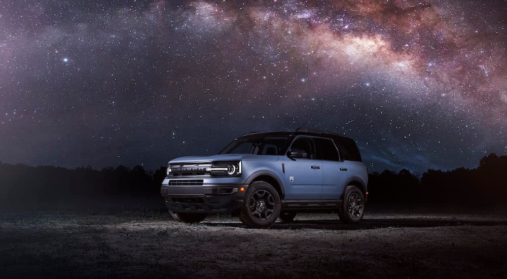 A blue 2024 Ford Bronco Sport is shown from the front at an angle after leaving a Ford dealership.