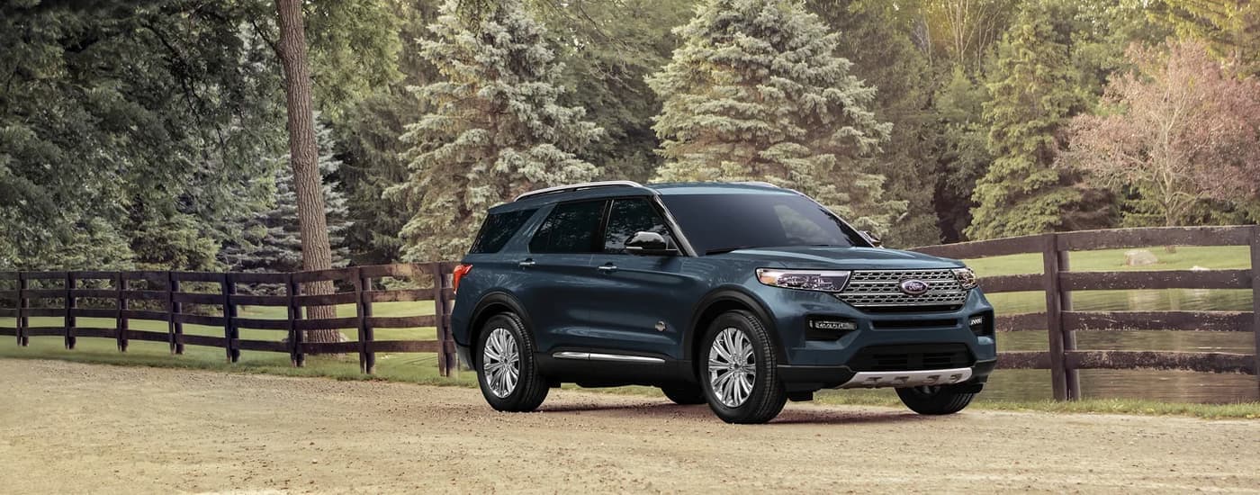 A blue 2024 Ford Explorer is shown from the front at an angle.