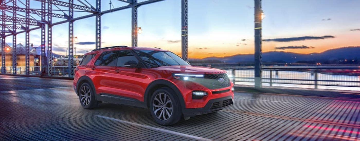 A red 2021 Ford Explorer ST is shown from the side.