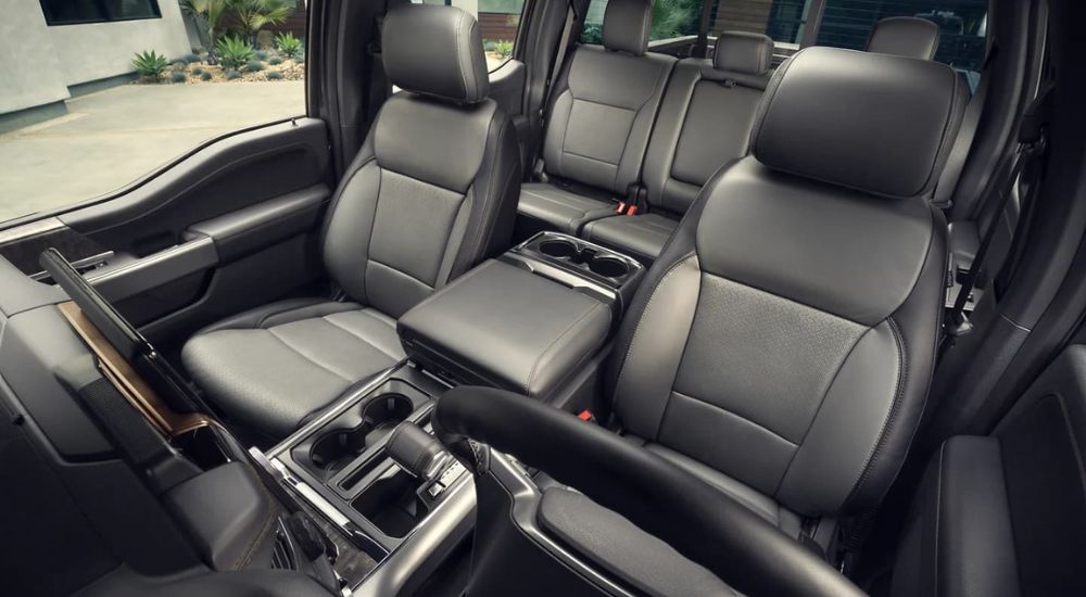 A close up shows the black leather seats in a 2022 Ford F-150 Lightning.
