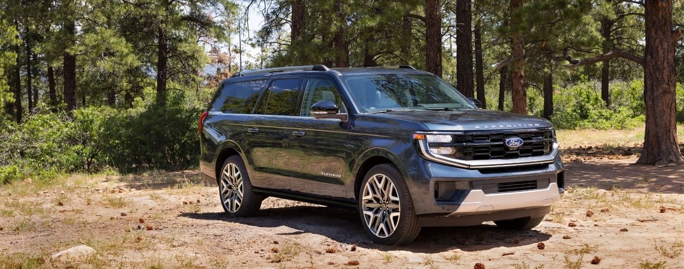 A blue 2025 Ford Expedition is shown from the front at an angle after leaving a Ford dealer near Huntingdon.