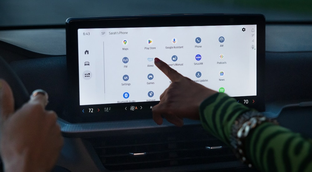 A passenger accessing the apps screen in a 2025 Ford Explorer.