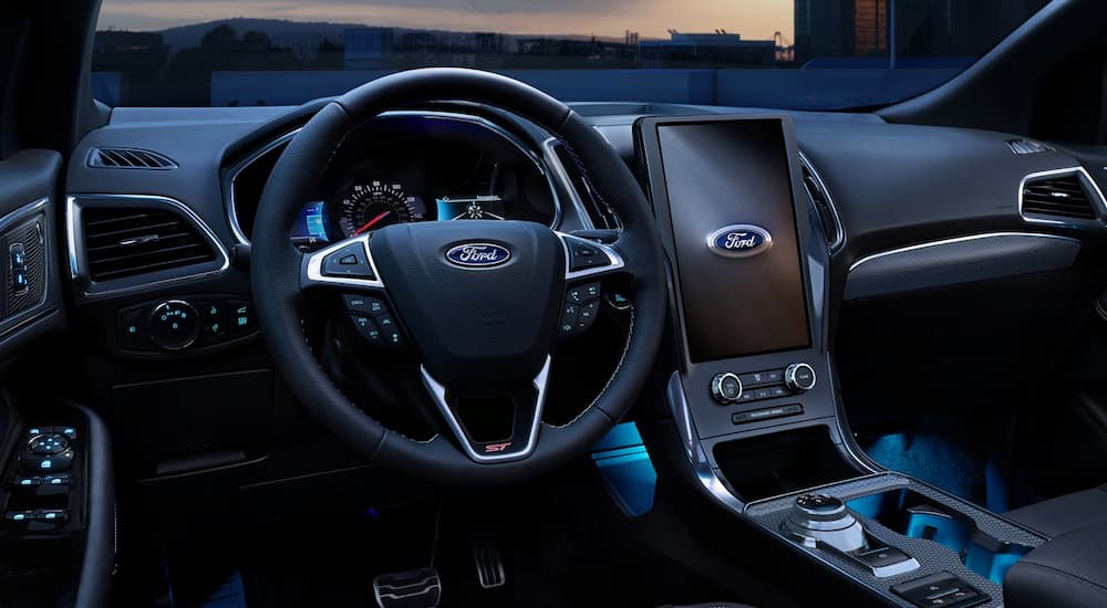 The steering wheel and infotainment screen in a 2024 Ford Edge at a Ford dealer near Humboldt.