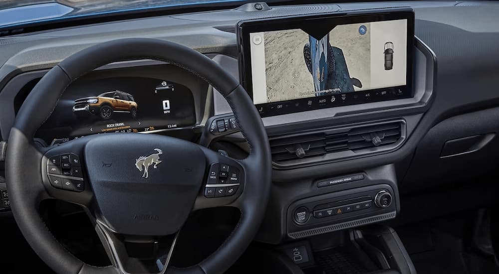 The steering wheel and center console of a 2025 Ford Bronco Sport for sale near Milan.