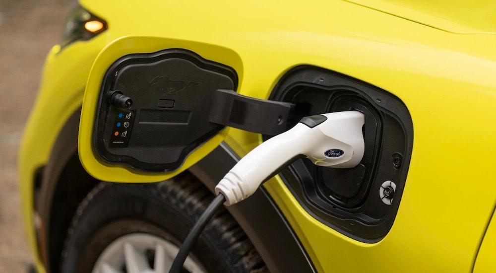 Ford%20EVs%20-%202024%20Ford%20Mustang%20Mach-E%20-%20Charging.jpeg A close-up on a yellow 2024 Ford Mustang Mach-E charging.