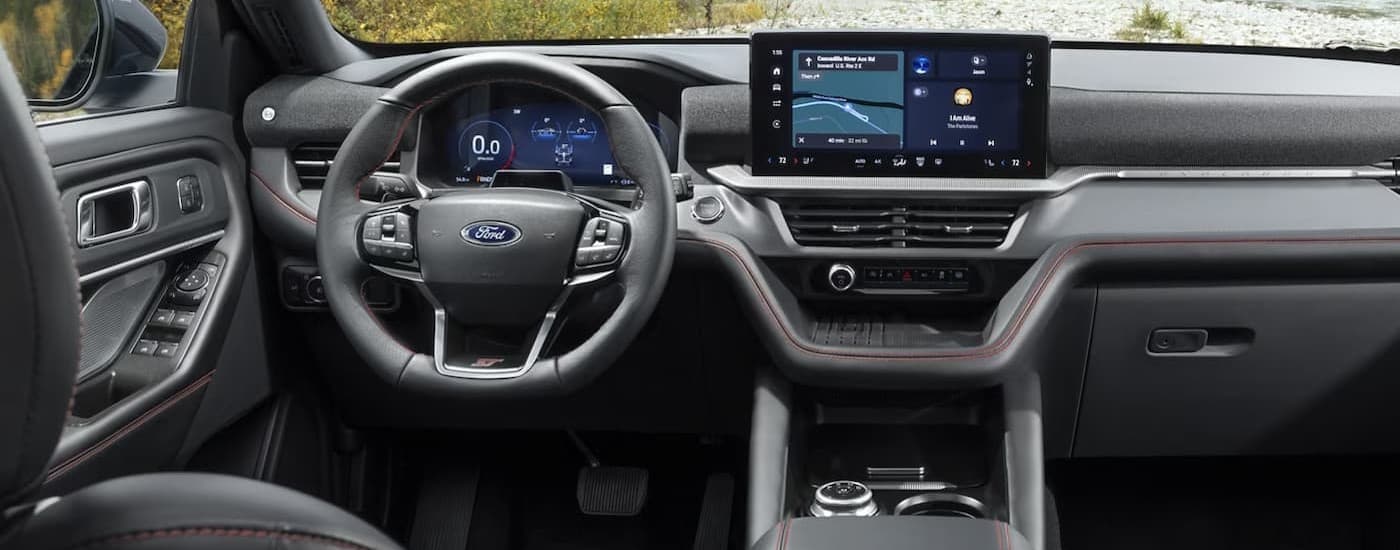 The black interior and dash are shown in a 2025 Ford Explorer ST.