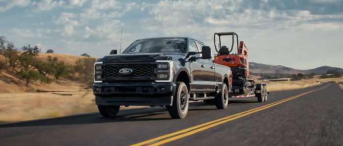 Ford%20F-250%20Hauling%20mini%20excavator-698x297.png