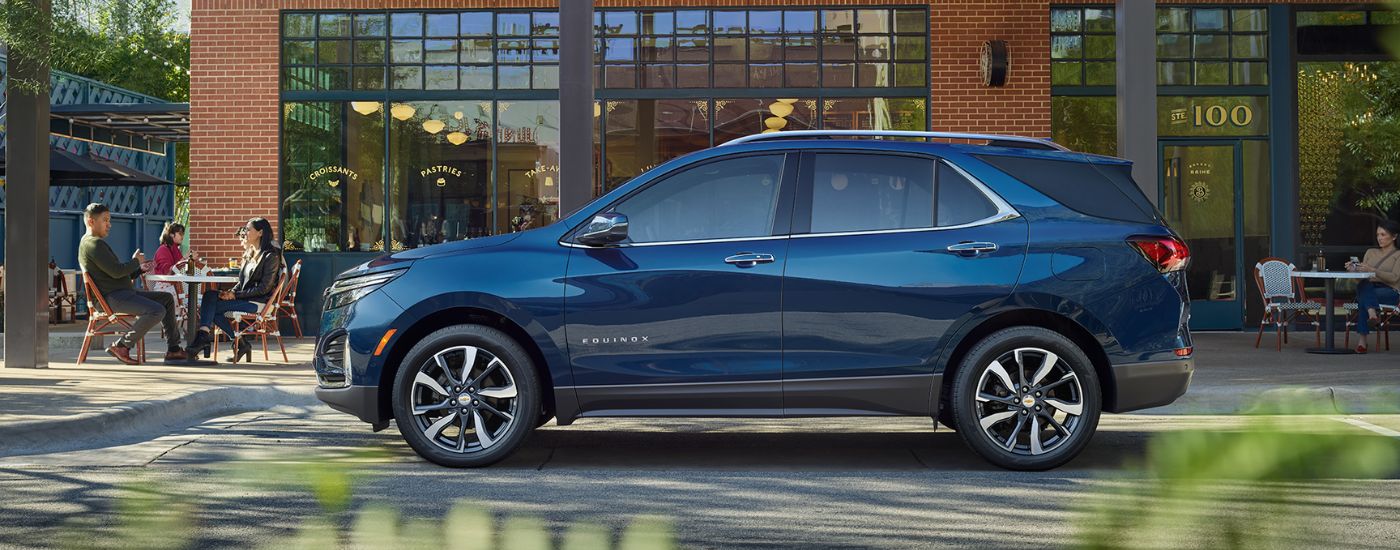 Blue 2022 Chevy Equinox parked outside a building.