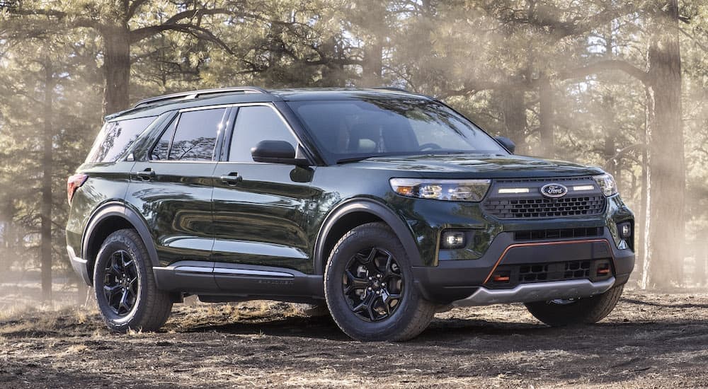 A green 2021 Ford Explorer Timberline is shown from the front at an angle after leaving a used Ford dealership.
