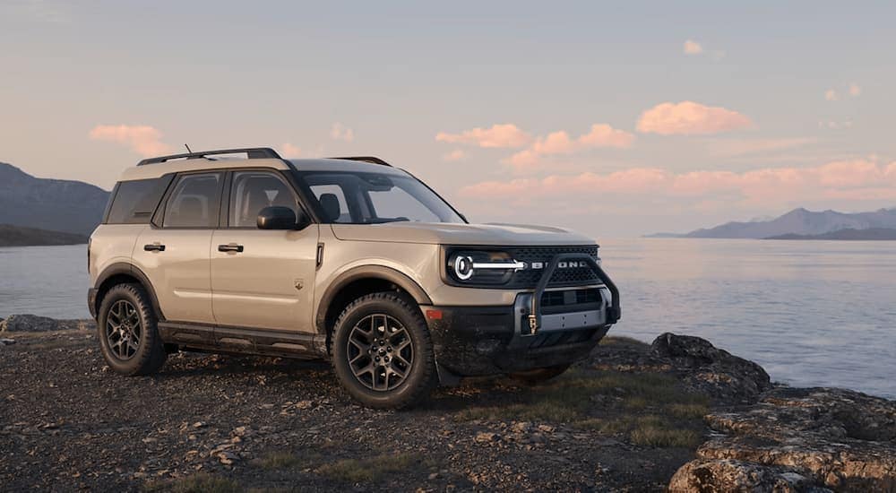 A grey 2025 Ford Bronco Sport parked near a lake.