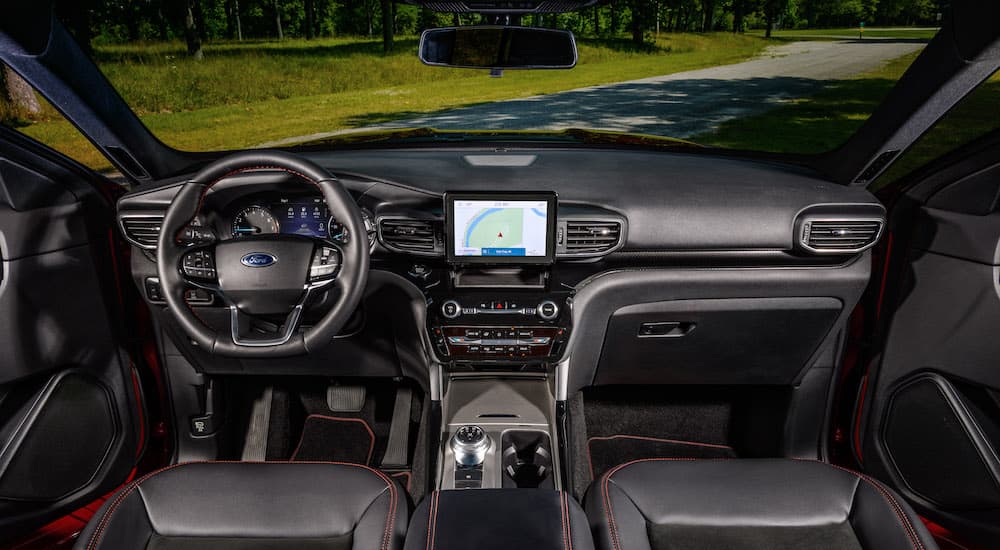 The black interior of a 2024 Ford Explorer ST-Line is shown from above the center console.