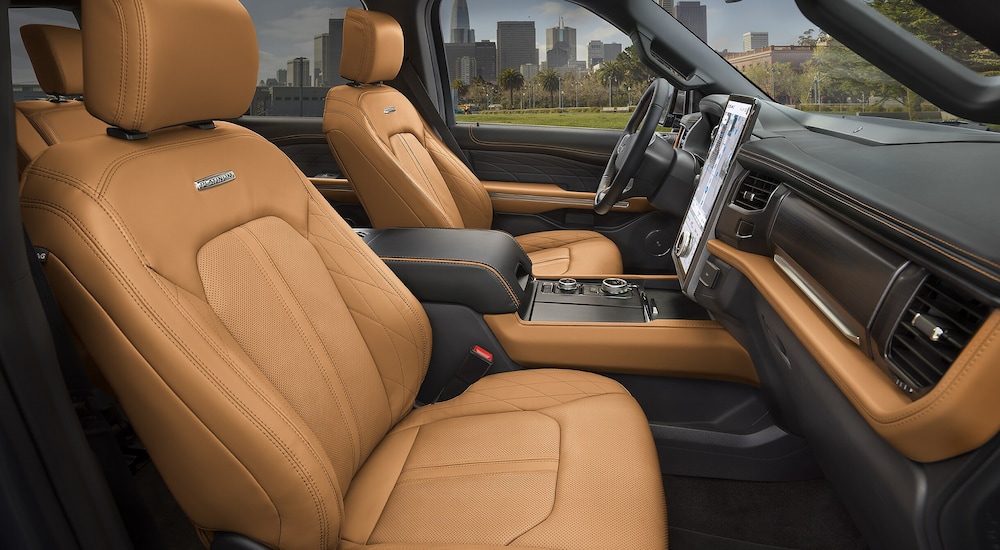 Tan leather upholstery in the cabin of a 2024 Ford Expedition Platinum.