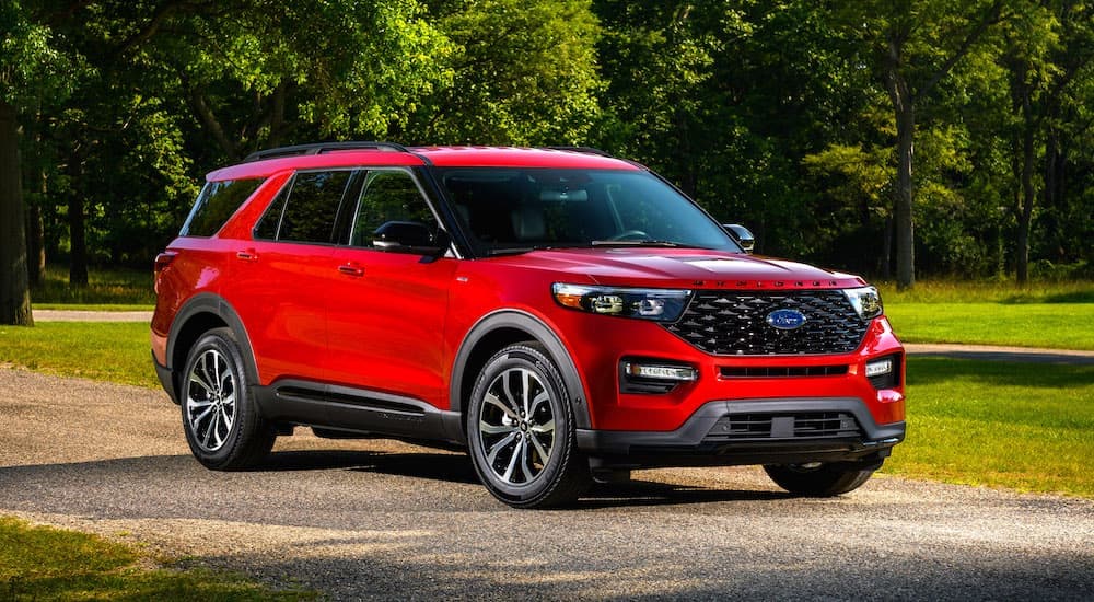 A red 2024 Ford Explorer ST-Line is shown from the front at an angle after leaving a Ford dealer near Jackson.