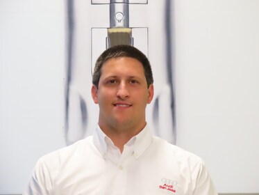 Staff member Alex Ewing from ID_543484