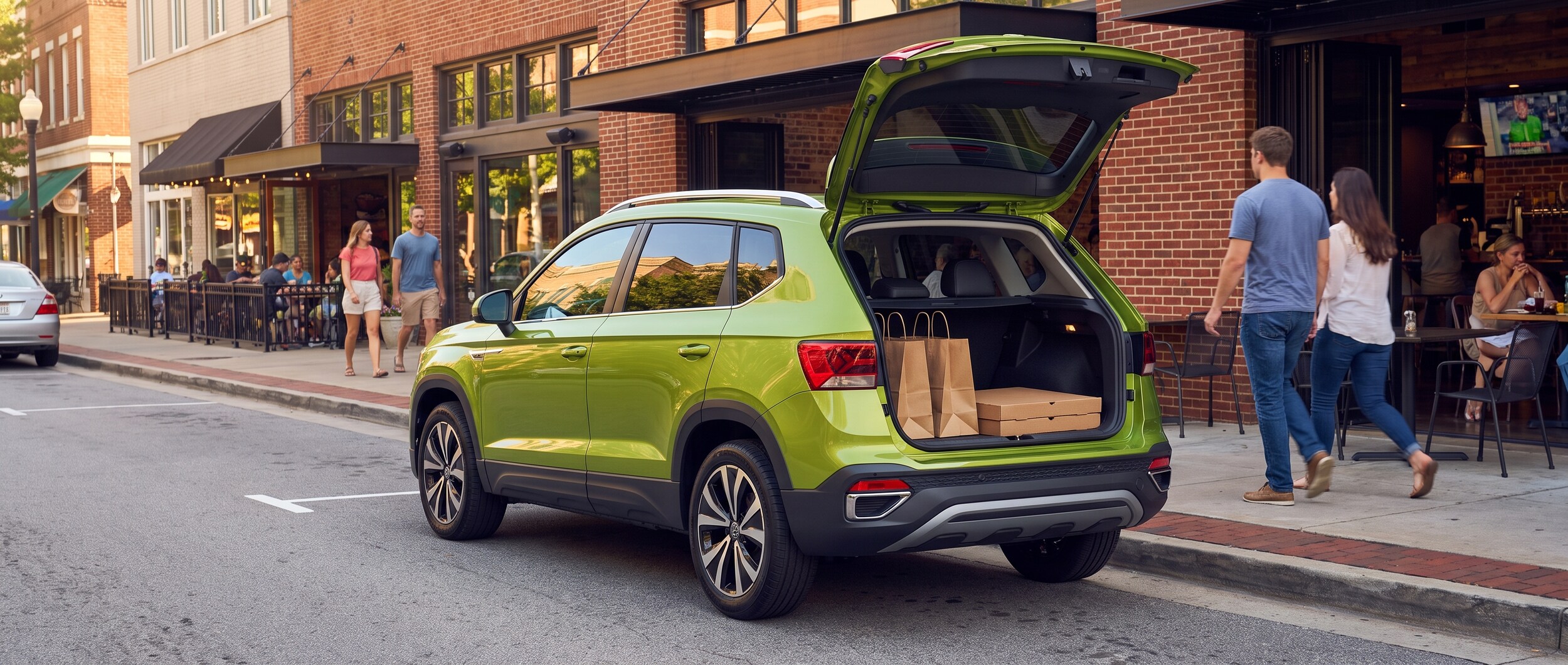 2026 Volkswagen Taos rear cargo area open with takeout bags on Woodruff Road Greenville SC