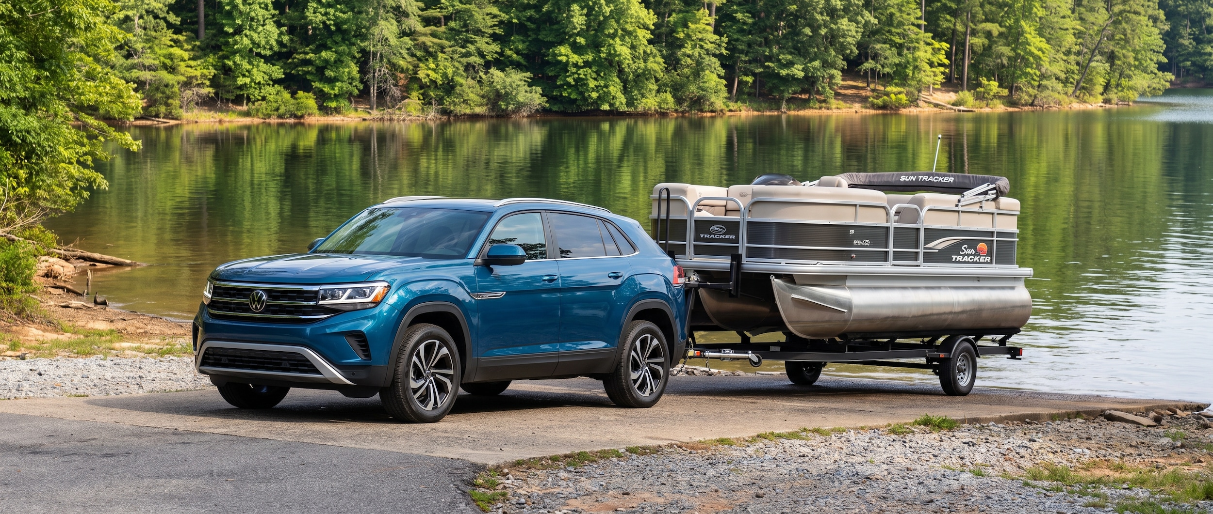 2026 Volkswagen Atlas Cross Sport at a Lake Hartwell boat launch in Anderson County, SC with a pontoon trailer on a sunny summer morning