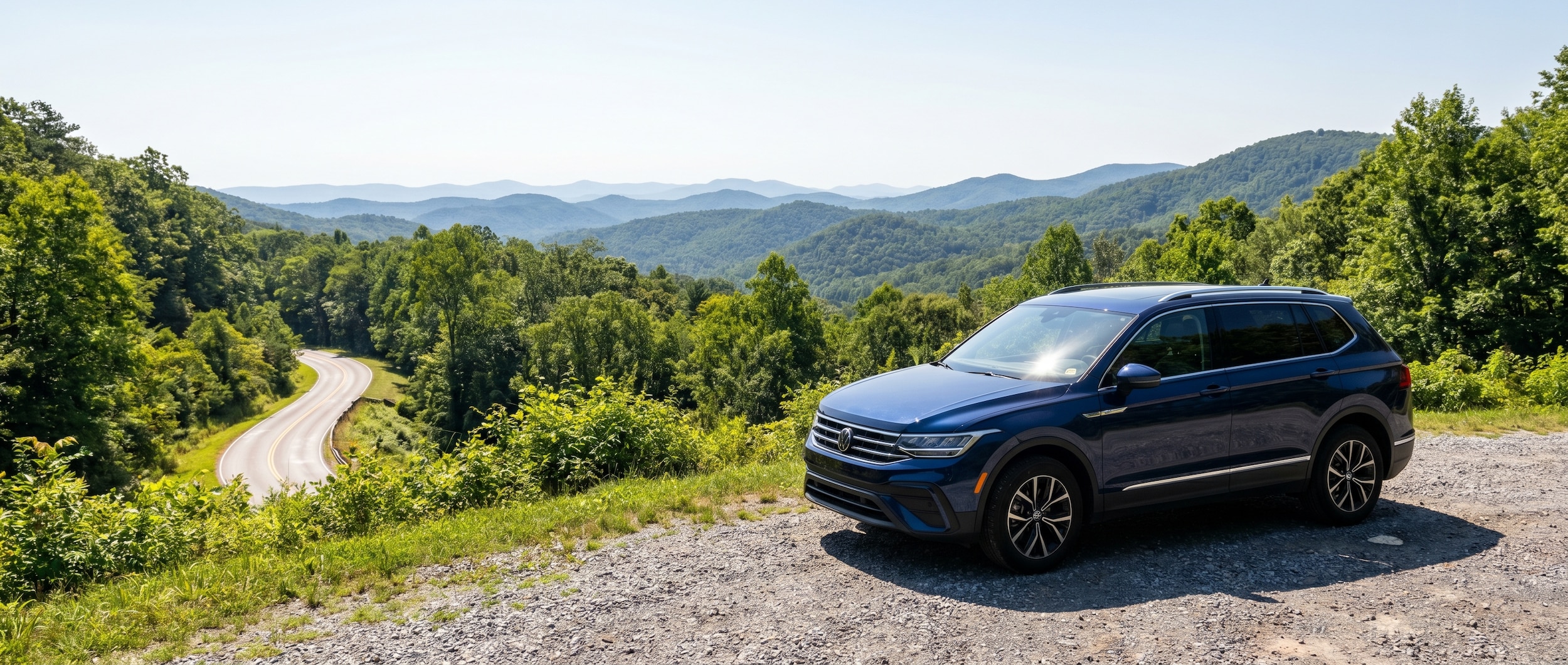 Volkswagen Tiguan on summer mountain road near Greenville SC showing brake safety awareness