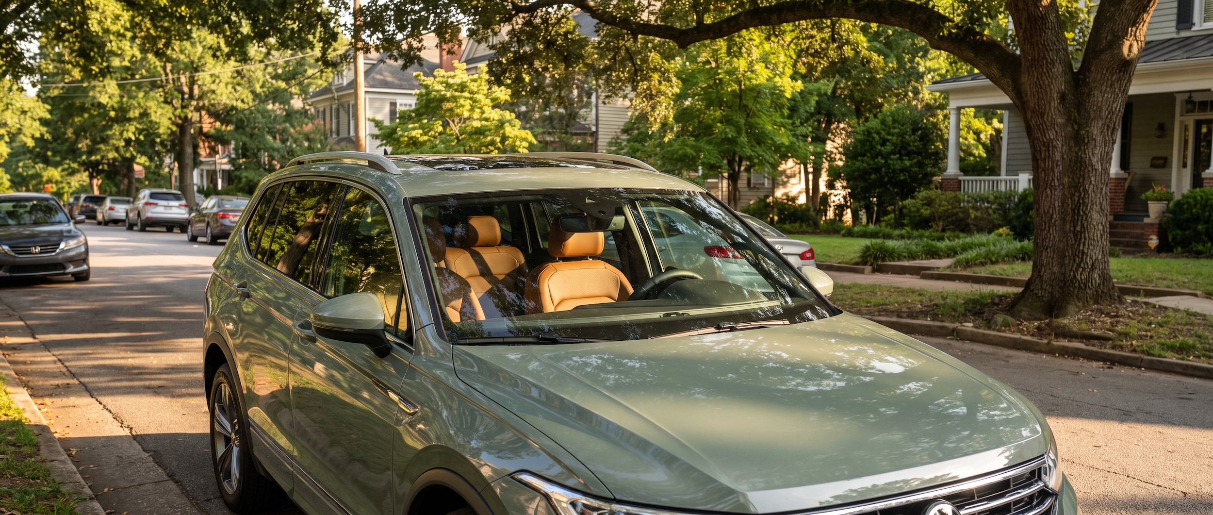 2026 Volkswagen Tiguan parked in shade in Greenville SC with climate control panel visible, summer afternoon