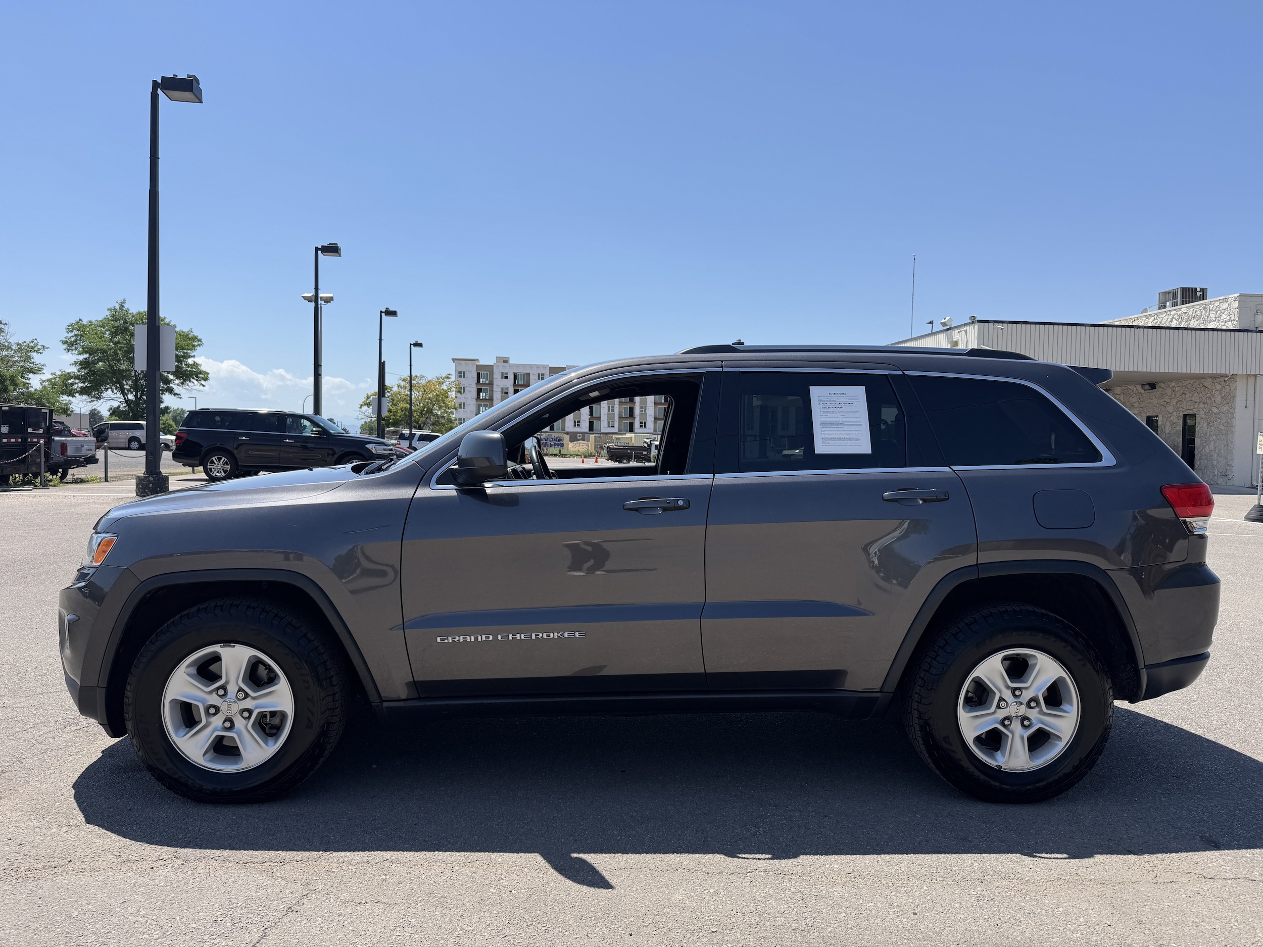 Used 2015 Jeep Grand Cherokee Laredo E with VIN 1C4RJFAG9FC691992 for sale in Aurora, CO