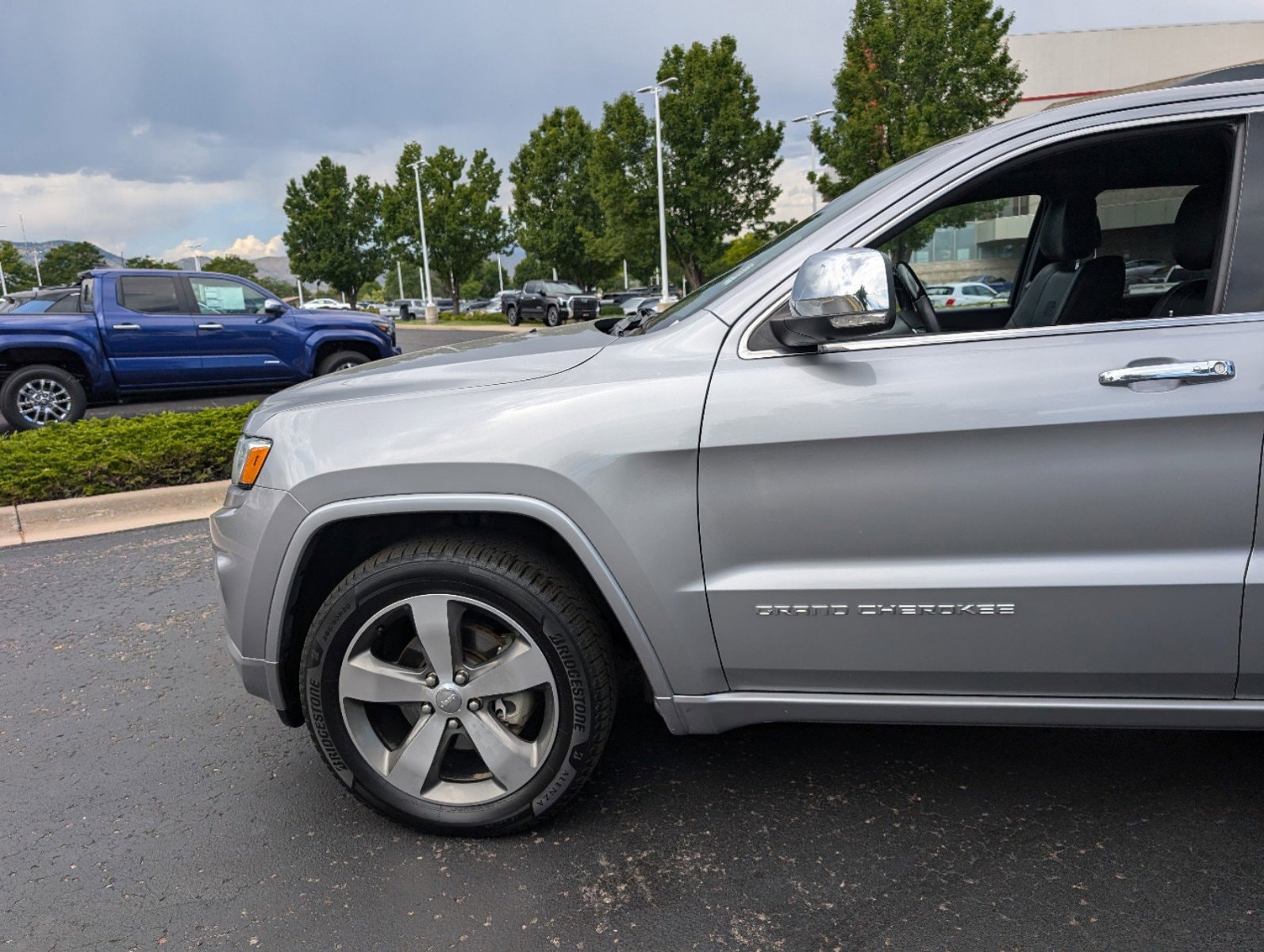 Used 2015 Jeep Grand Cherokee Overland with VIN 1C4RJFCG4FC244208 for sale in Lakewood, CO